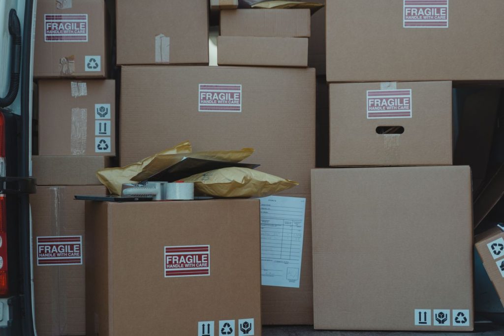 Export-grade packing cartons and bubble wrap laid out ready for a European part load collection